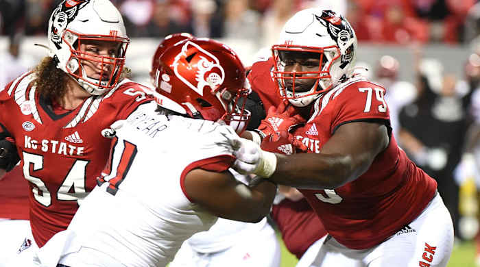 Oct 30, 2021; Raleigh, North Carolina, USA; North Carolina State Wolfpack tackle Ikem Ekwonu (79) blocks during the first half against the Louisville Cardinals at Carter-Finley Stadium.